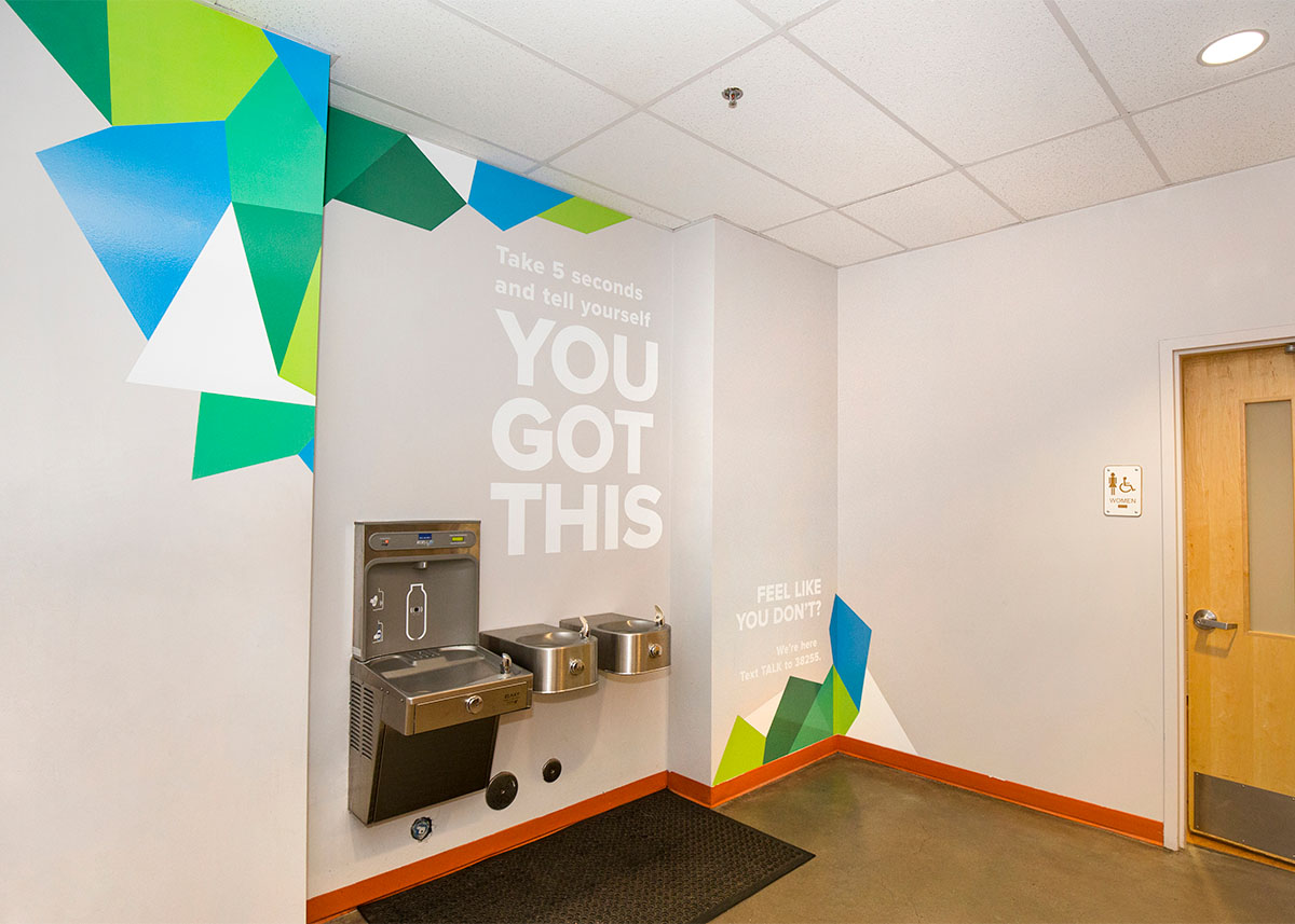 Water fountain with "You Got This" above it.